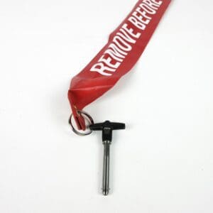 Red "Remove Before Flight" tag with pin.