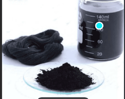 Black powder and liquid in glass jar.