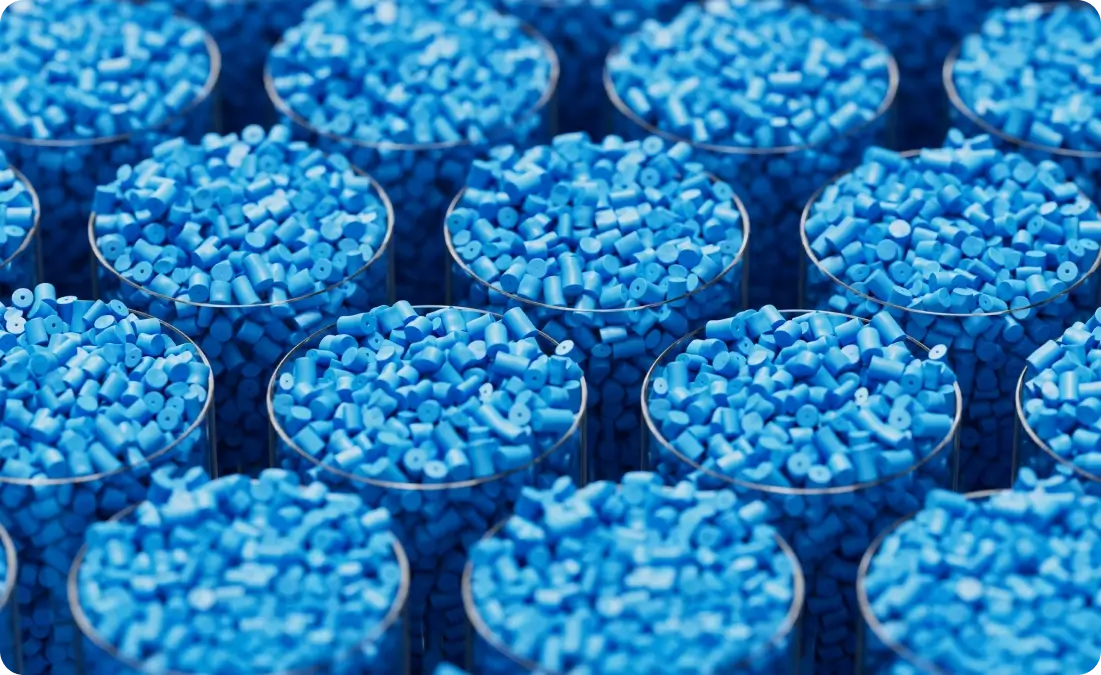 Blue plastic pellets in transparent containers.