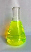 A flask containing bright yellow-green liquid.