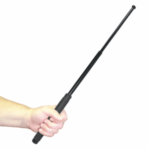 Hand holding a black telescopic baton.