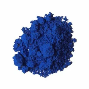 A pile of vibrant blue pigment powder on a white background.